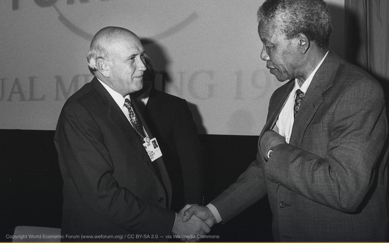 Frederik de Klerk and Nelson Mandela shake hands at the Annual Meeting of the World Economic Forum held in Davos in January 1992 Copyright World Economic Forum (www.weforum.org) — related to The Great Reset Conspiracy